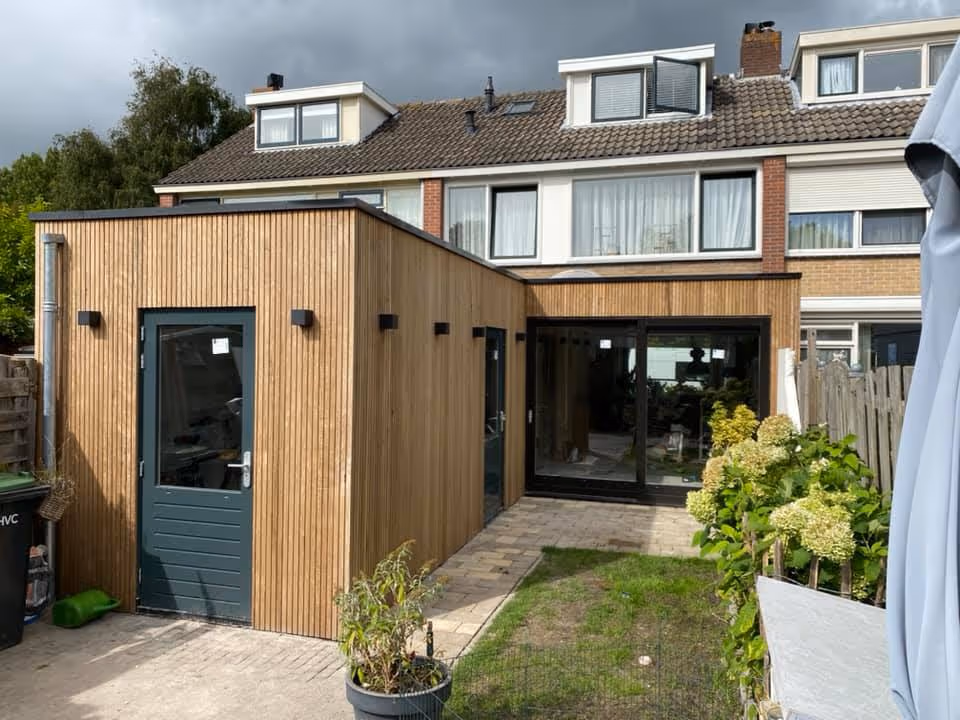 Modern open living space with fireplace and large windows