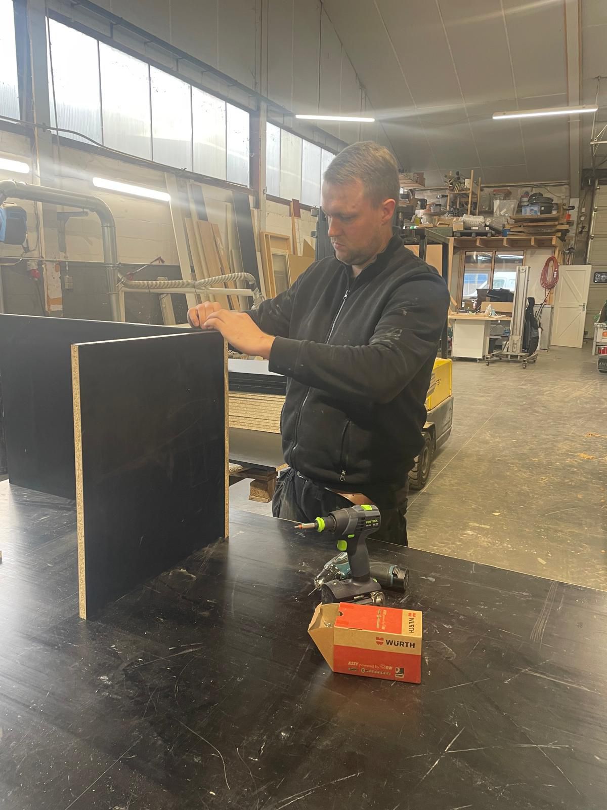 Rattan chair by a window with indoor plant